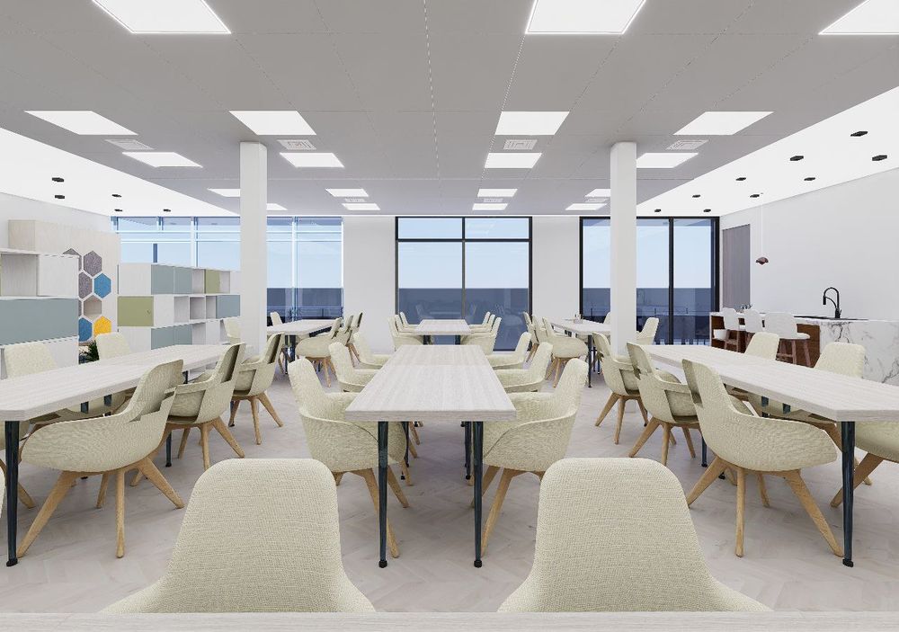 Render of a study lounge with upholstered chairs around shared tables